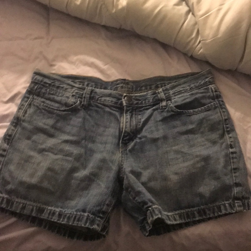 They are A dark blue washed denim shorts